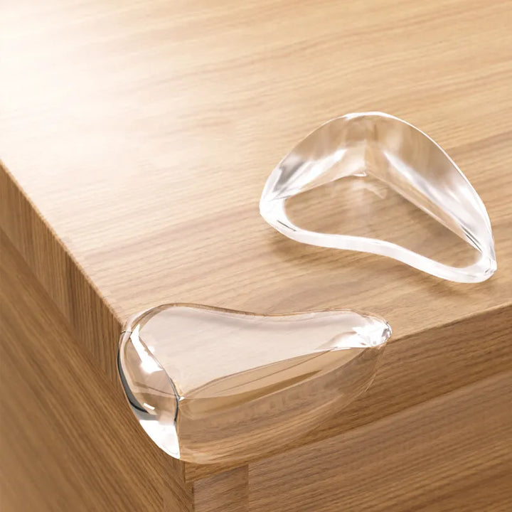 4-pack clear silicone corner guards for baby safety & child proofing sharp furniture edges. Essential home protection.