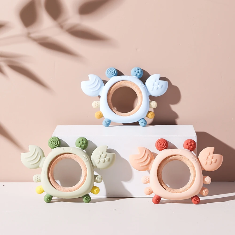 Soft silicone crab teether for babies, designed to soothe sore gums. A safe and effective infant teething toy.