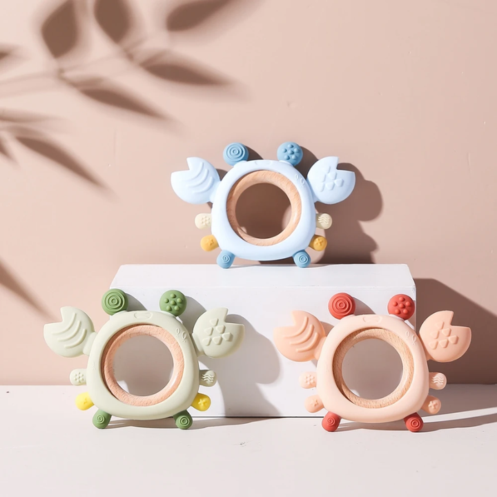 Soft silicone crab teether for babies, designed to soothe sore gums. A safe and effective infant teething toy.