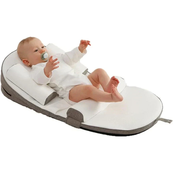 Anti-reflux baby wedge pillow for safe side sleeping, effectively preventing spit-up & providing infant comfort.