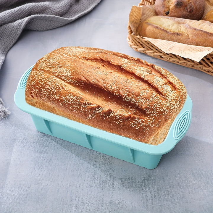 Assorted non-stick silicone molds including cake pan, muffin tray, doughnut & bread loaf for diverse home baking.