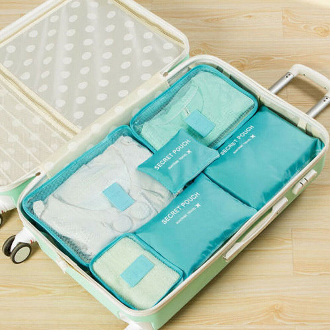 Multi-piece luggage packing organizer set, showcasing various sizes for all travel needs.