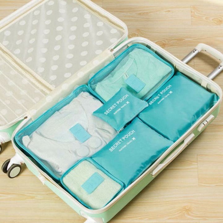 Multi-piece luggage packing organizer set, showcasing various sizes for all travel needs.