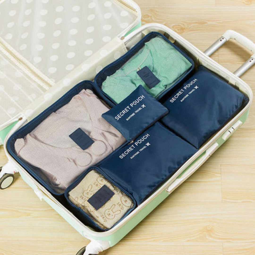 Unisex travel set of packing cubes and organizers, perfect for efficient and compact luggage.