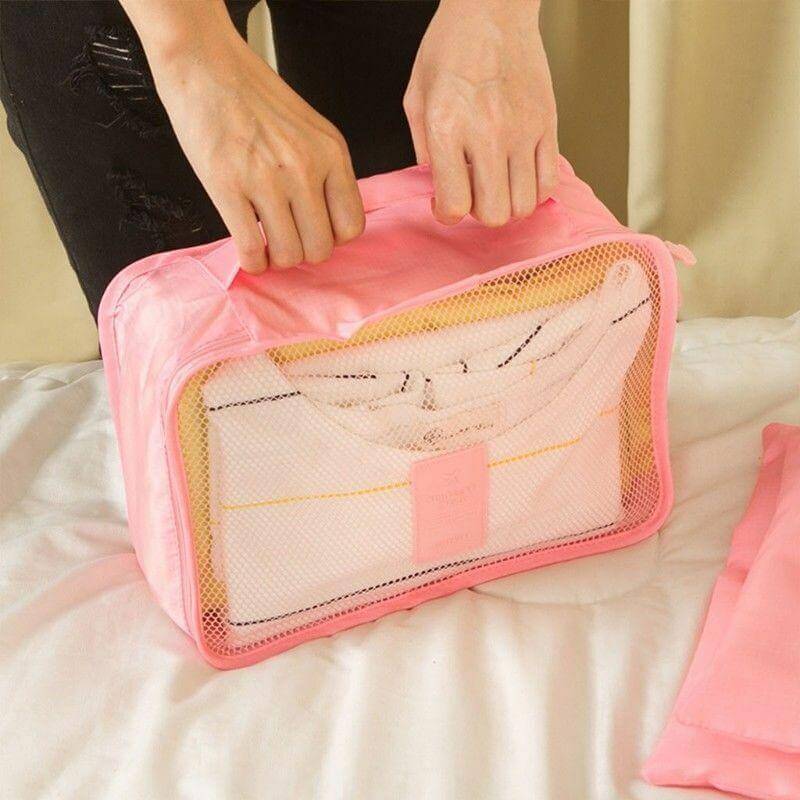 Assorted sizes of packing cubes in a luggage organizer set. Maximize suitcase space easily.
