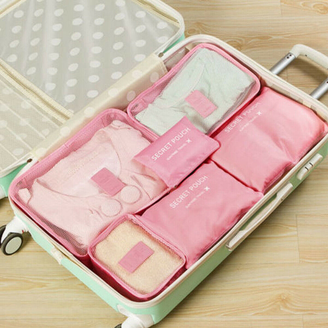 Neatly folded clothes organized in a space-saving travel bag. Perfect for efficient packing.