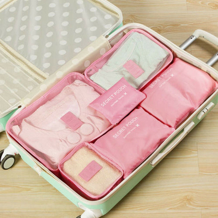 Neatly folded clothes organized in a space-saving travel bag. Perfect for efficient packing.