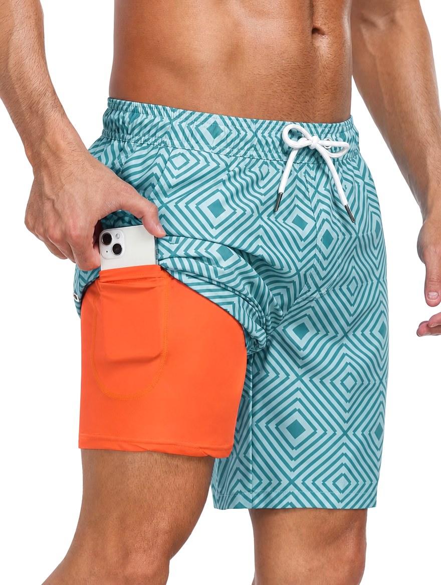 Summer men's swimwear: tropical print mid-thigh shorts with adjustable drawstring for ultimate comfort.