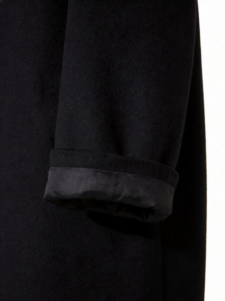 Elegant men's long trench coat, classic tailored design for refined outerwear fashion.