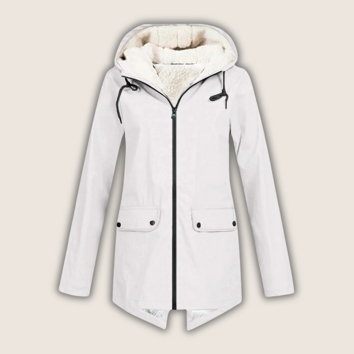 Comfortable women's stylish waterproof rain jacket featuring an adjustable hood, great for city or trail.