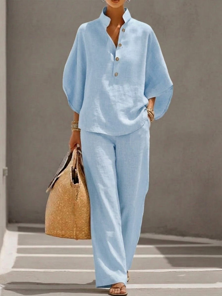 Chic women's batwing sleeve top & wide-leg pant set, perfect for loungewear or effortless resort style.