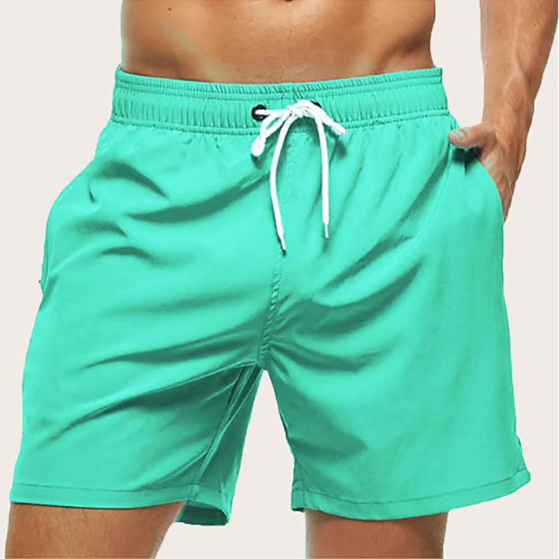 Perfect men's quick-dry swim shorts for vacation. Relaxed fit, drawstring, comfortable beach & pool wear.