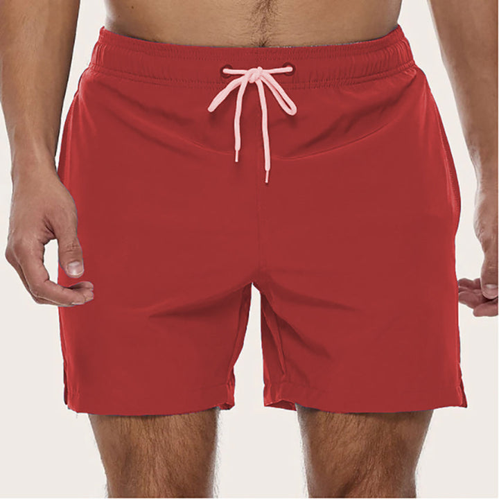 Drawstring men's quick-dry swim shorts. Relaxed fit beachwear, perfect for summer pool days.