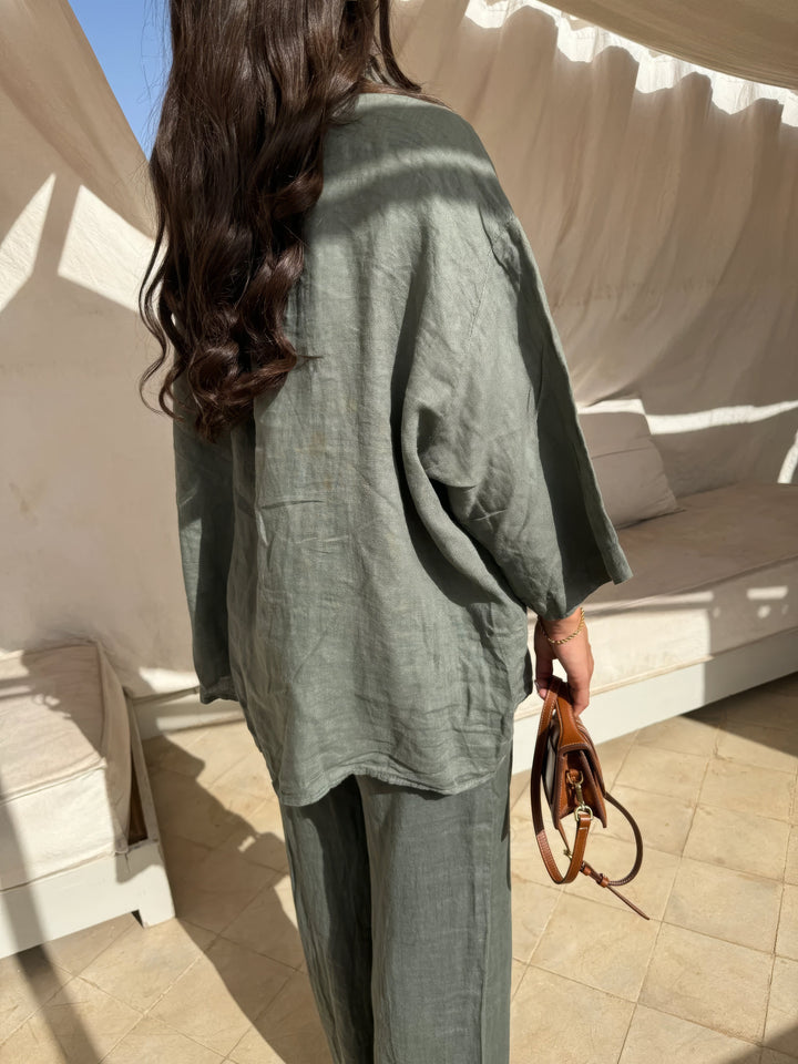 Comfortable beige women's two-piece set with a long sleeve top & wide-leg pants, perfect for summer fashion.