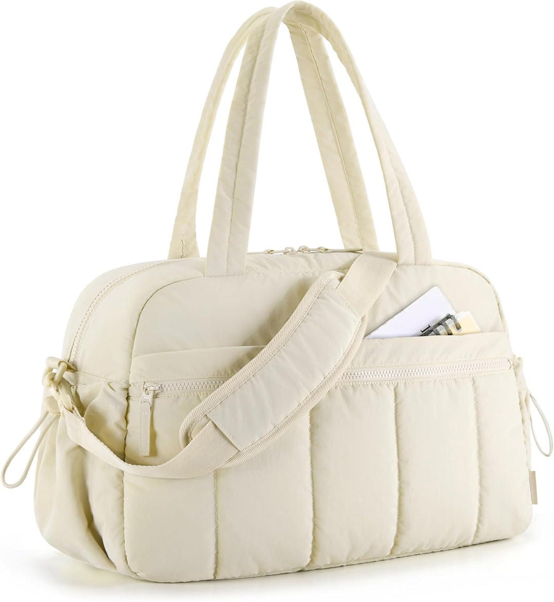Beige women's versatile duffle bag for gym, travel, or everyday use. Features shoulder strap & spacious interior.