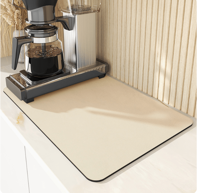 Quick-dry absorbent diatomite kitchen mat for drying dishes & protecting countertops.