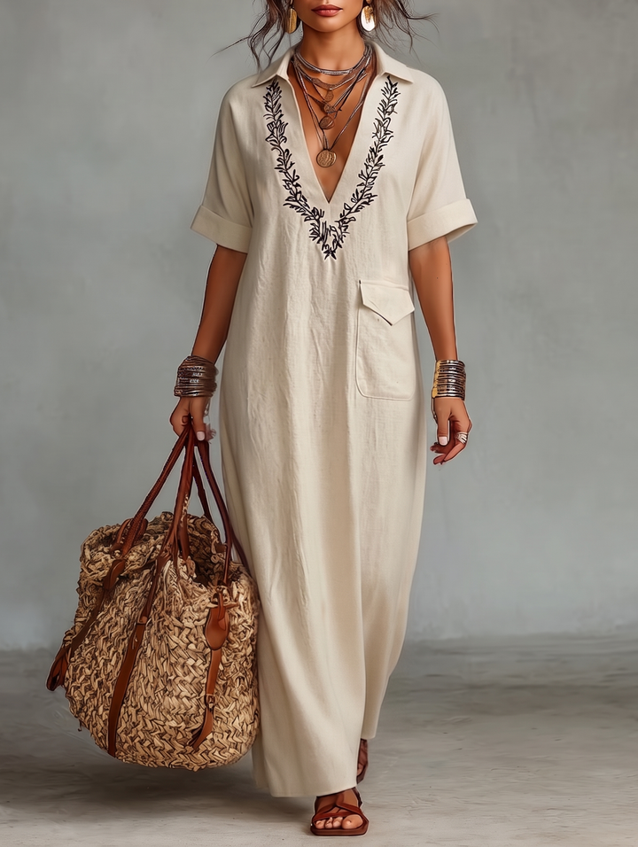 Women's timeless embroidered V-neck boho maxi dress. Flowy summer beachwear, perfect for vacation.