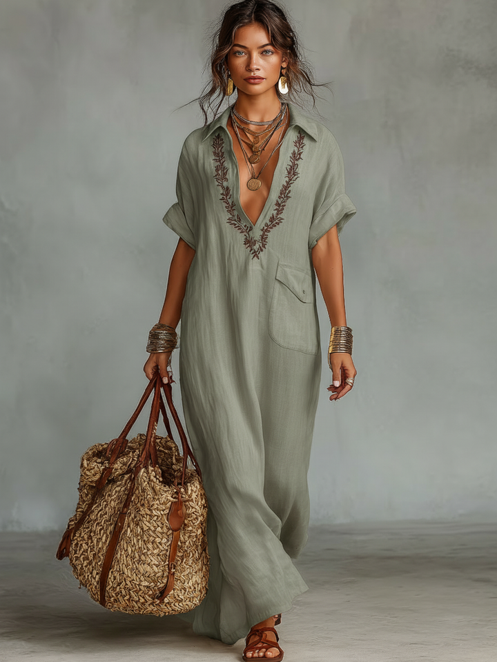 Front view of a women's elegant boho maxi dress with V-neck & intricate embroidery. Ideal for summer casual wear.