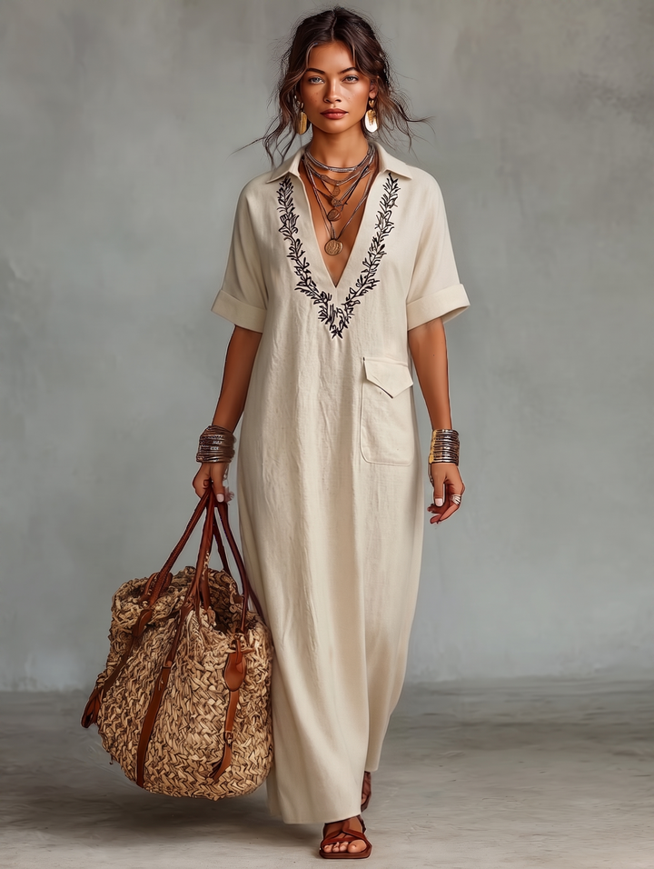 Relaxed fit women's boho maxi dress, featuring a flattering V-neck and exquisite embroidery. Great for beachwear.