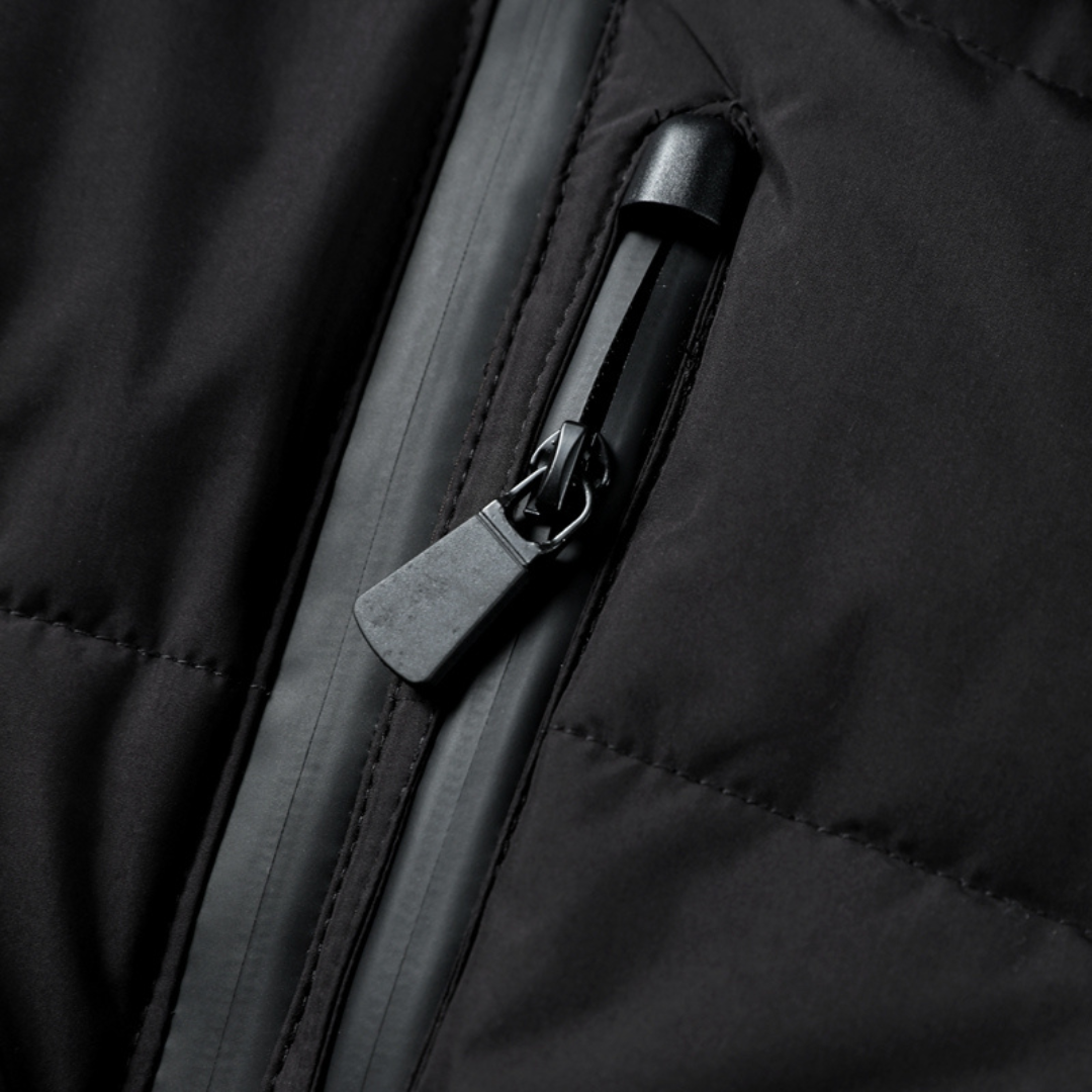Fashionable women's black belted puffer jacket. Chic, flattering, and warm quilted winter outerwear.
