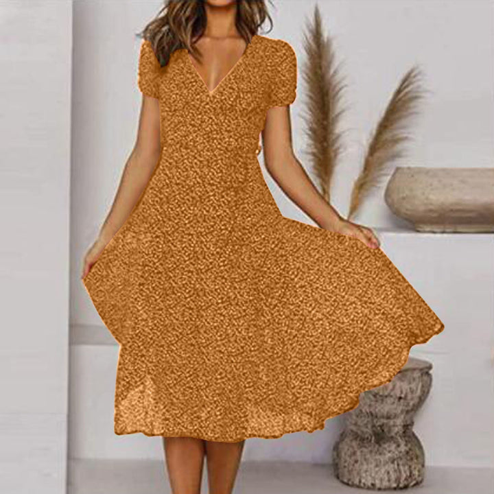 Flowy yellow V-neck A-line midi dress for women. Comfortable & elegant summer fashion with delicate puff sleeves.