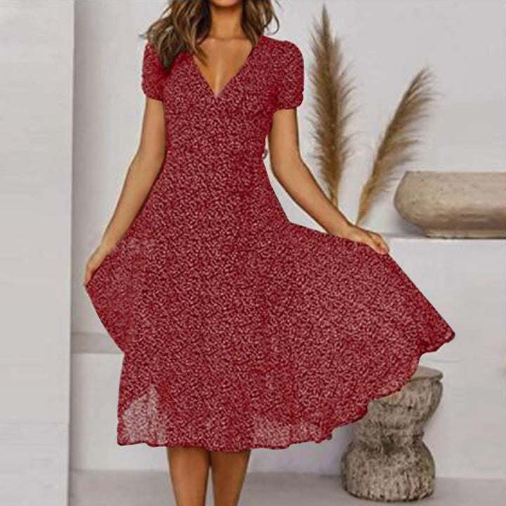 Casual chic navy V-neck A-line midi dress for women, offering a comfortable fit and stylish puff sleeves.