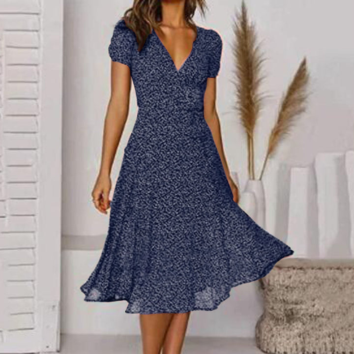 Red V-neck A-line midi dress with puff sleeves. A sophisticated and elegant choice for women's summer fashion.