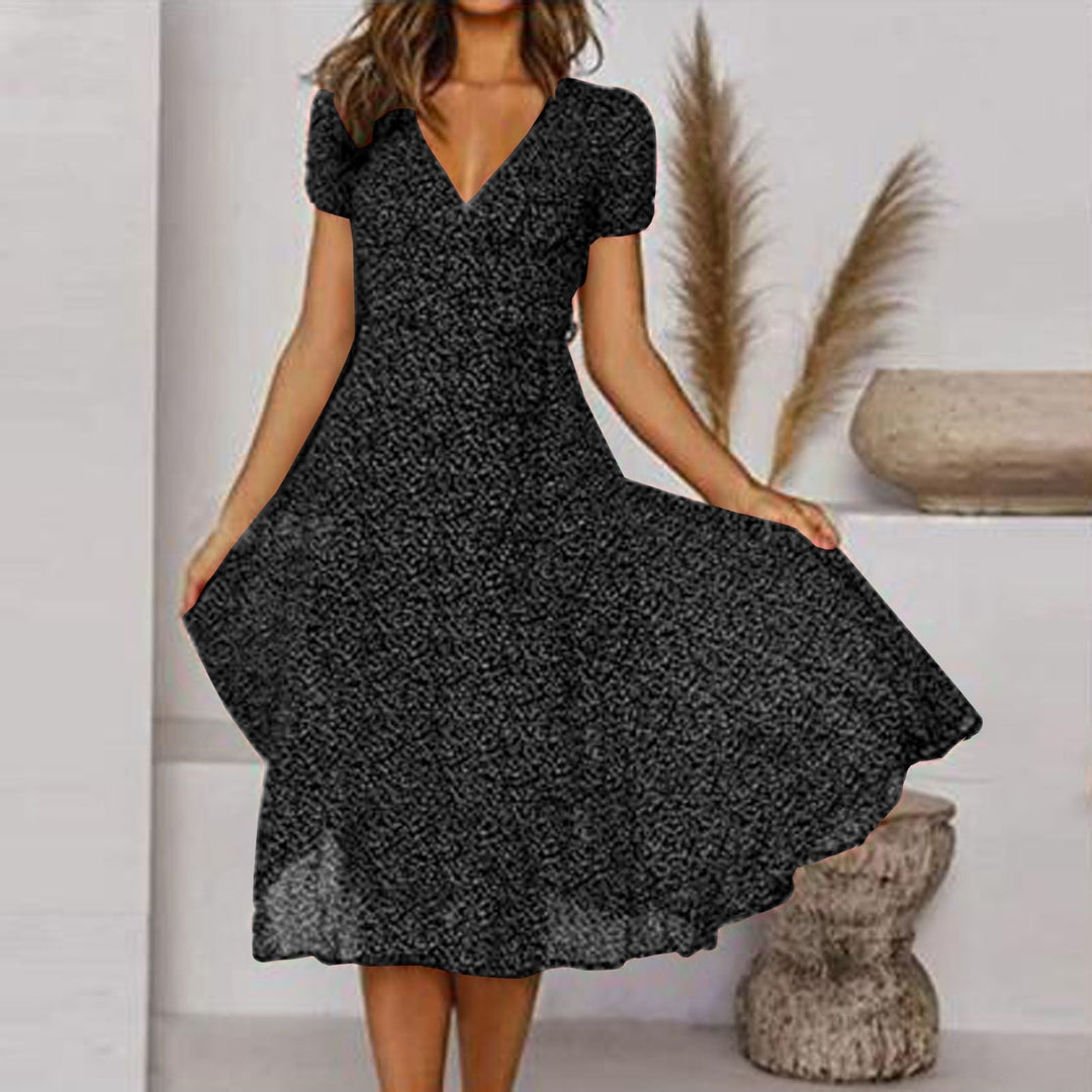 Women's versatile green V-neck A-line midi dress, perfect for work or casual outings, featuring puff sleeves.