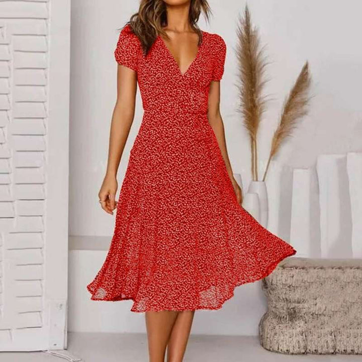 Stylish women's V-neck A-line midi dress in black, featuring elegant puff sleeves and a flattering flowy cut.