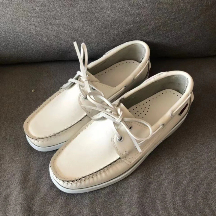 Men's stylish two-tone lace-up boat shoes with contrasting sole, great for summer, coastal & comfort.