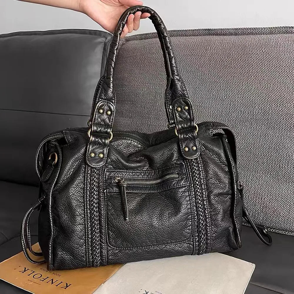 Stylish black women's everyday handbag. Versatile shoulder & crossbody purse with secure closure.