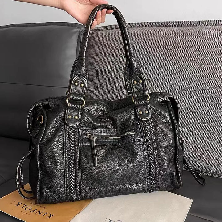 Stylish black women's everyday handbag. Versatile shoulder & crossbody purse with secure closure.