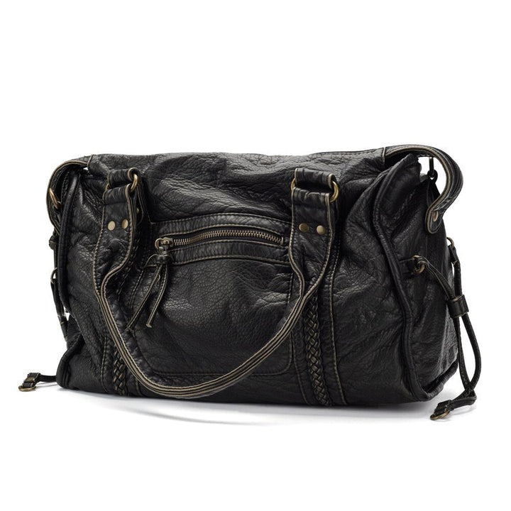 Women's chic black everyday shoulder bag. Perfect work or class accessory with vintage-inspired design.