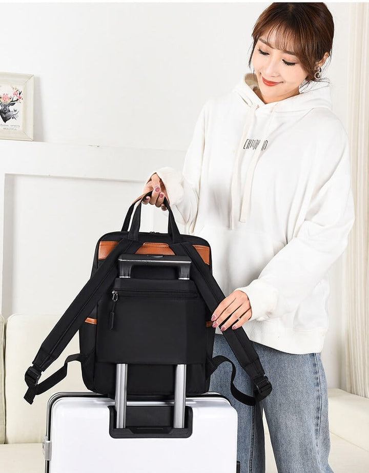 Unisex anti-theft school backpack in cream, organized compartments & lightweight design.