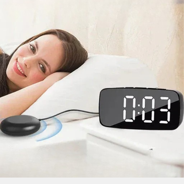 The Vibrating Alarm Clock: a powerful bed shaker, loud alarm, and modern digital display for deep and heavy sleepers.