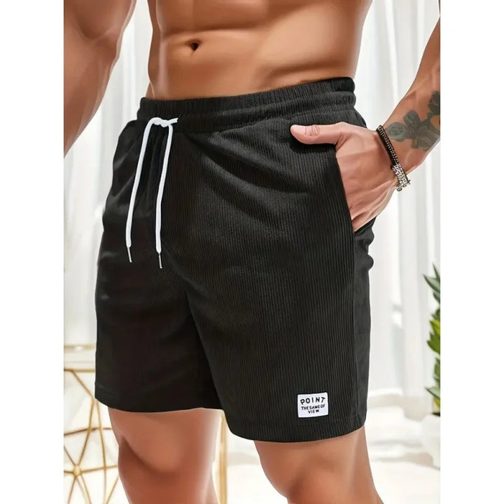 Comfortable men's drawstring shorts, relaxed fit, ideal for casual summer style & versatile everyday wear.