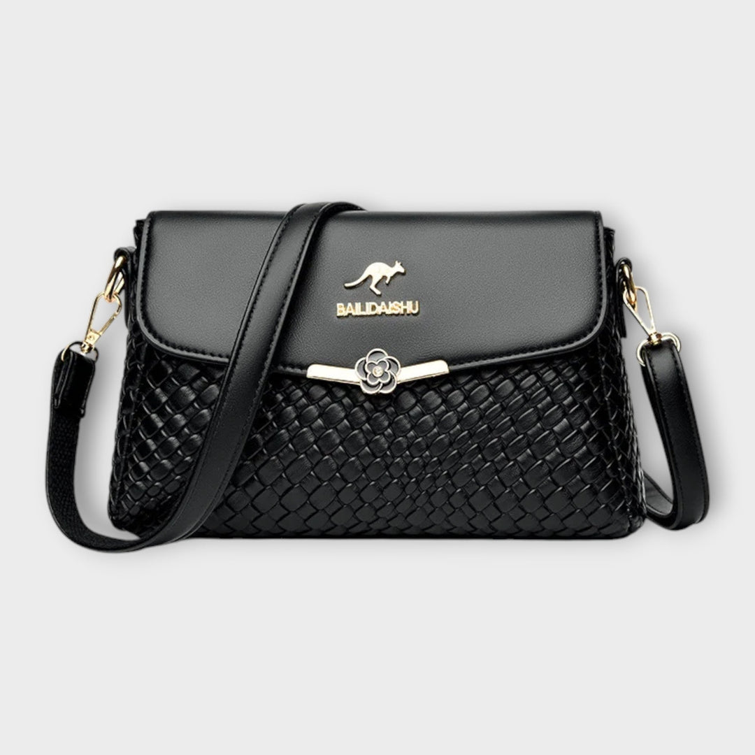 Elegant black women's shoulder bag, a chic fashion accessory perfect for everyday style and versatility.