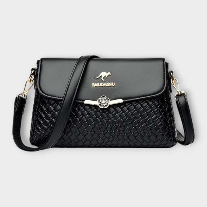 Elegant black women's shoulder bag, a chic fashion accessory perfect for everyday style and versatility.