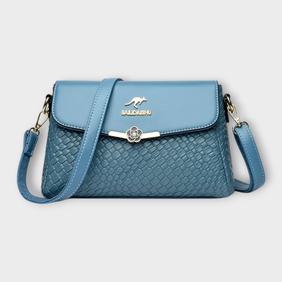 Stylish blue women's shoulder bag, a versatile handbag for ladies, adding everyday chic to any outfit.