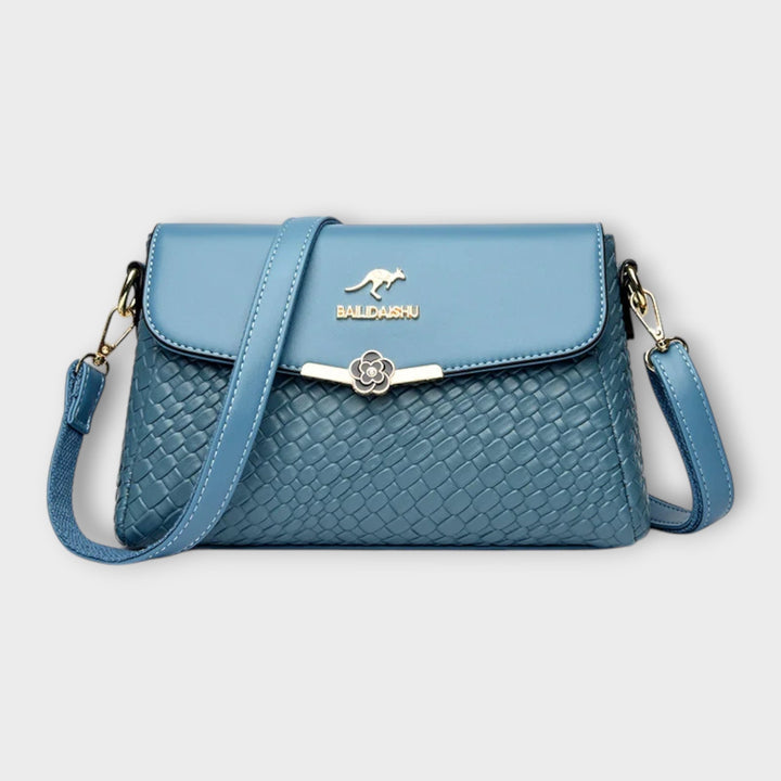Stylish blue women's shoulder bag, a versatile handbag for ladies, adding everyday chic to any outfit.
