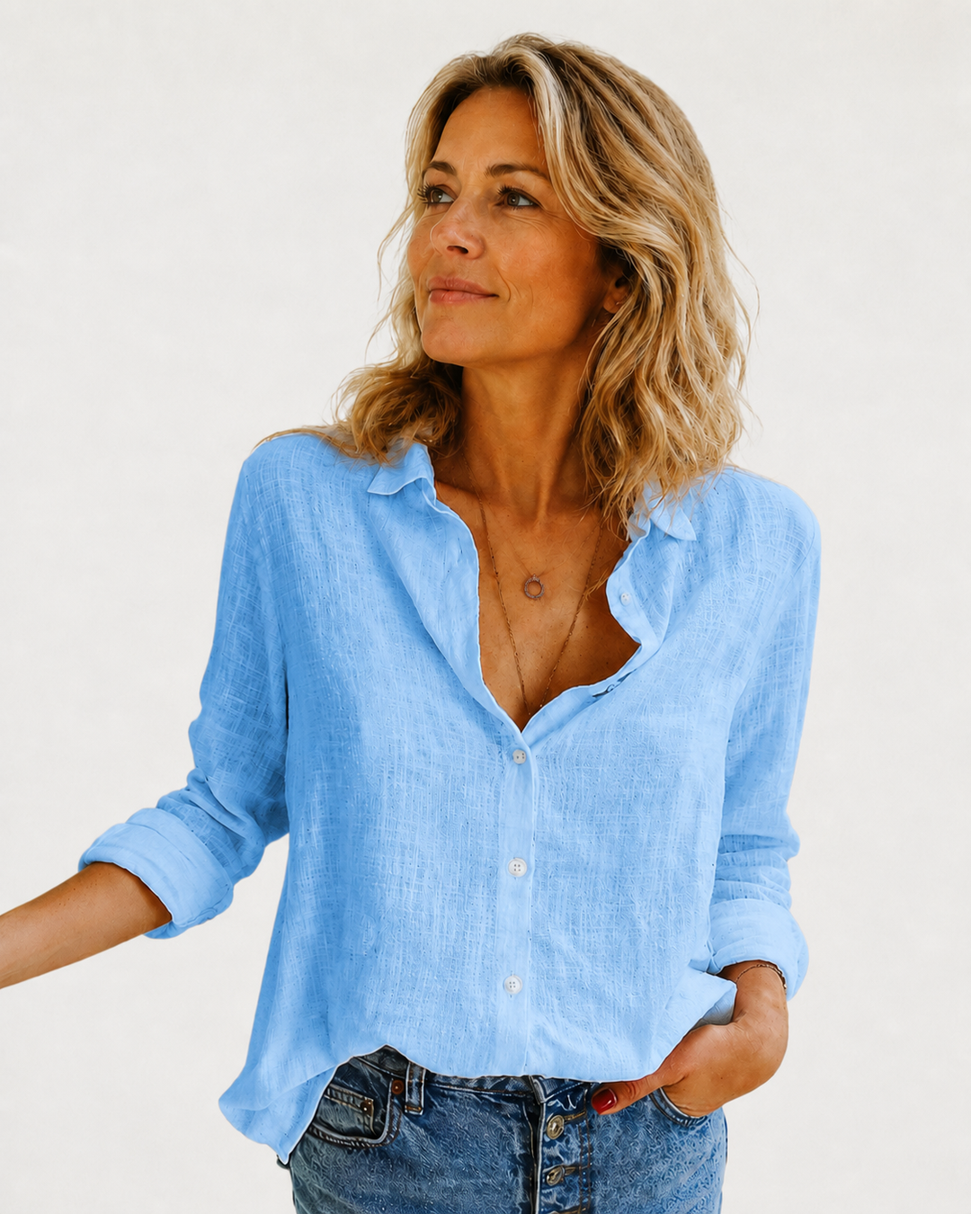 Elegant women's long sleeve button-down blouse, a versatile collared top for office and casual everyday fashion.