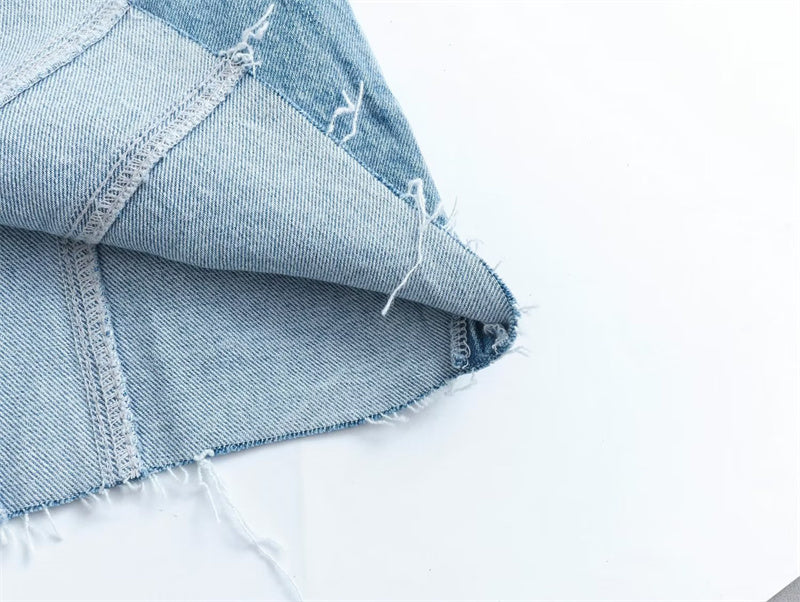 Elegant strapless design of a women's denim mini dress, perfect for chic casual or party looks. Sleeveless.
