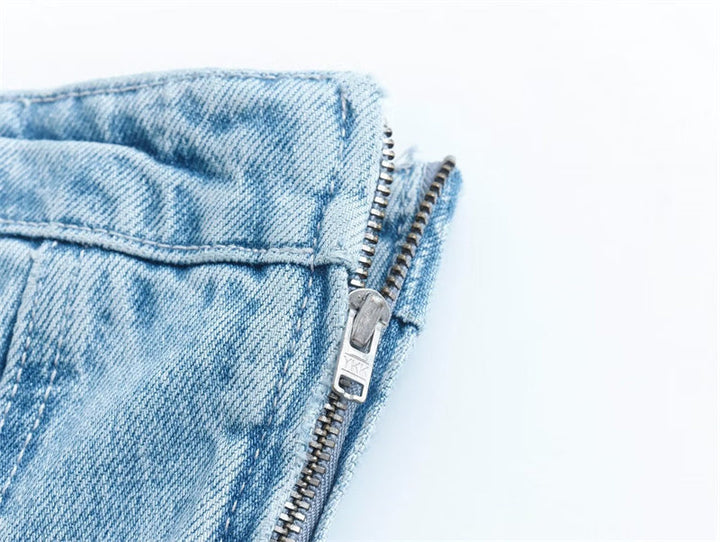 Bobbie strapless denim mini dress on a mannequin. Chic women's clothing, suitable for casual or party.
