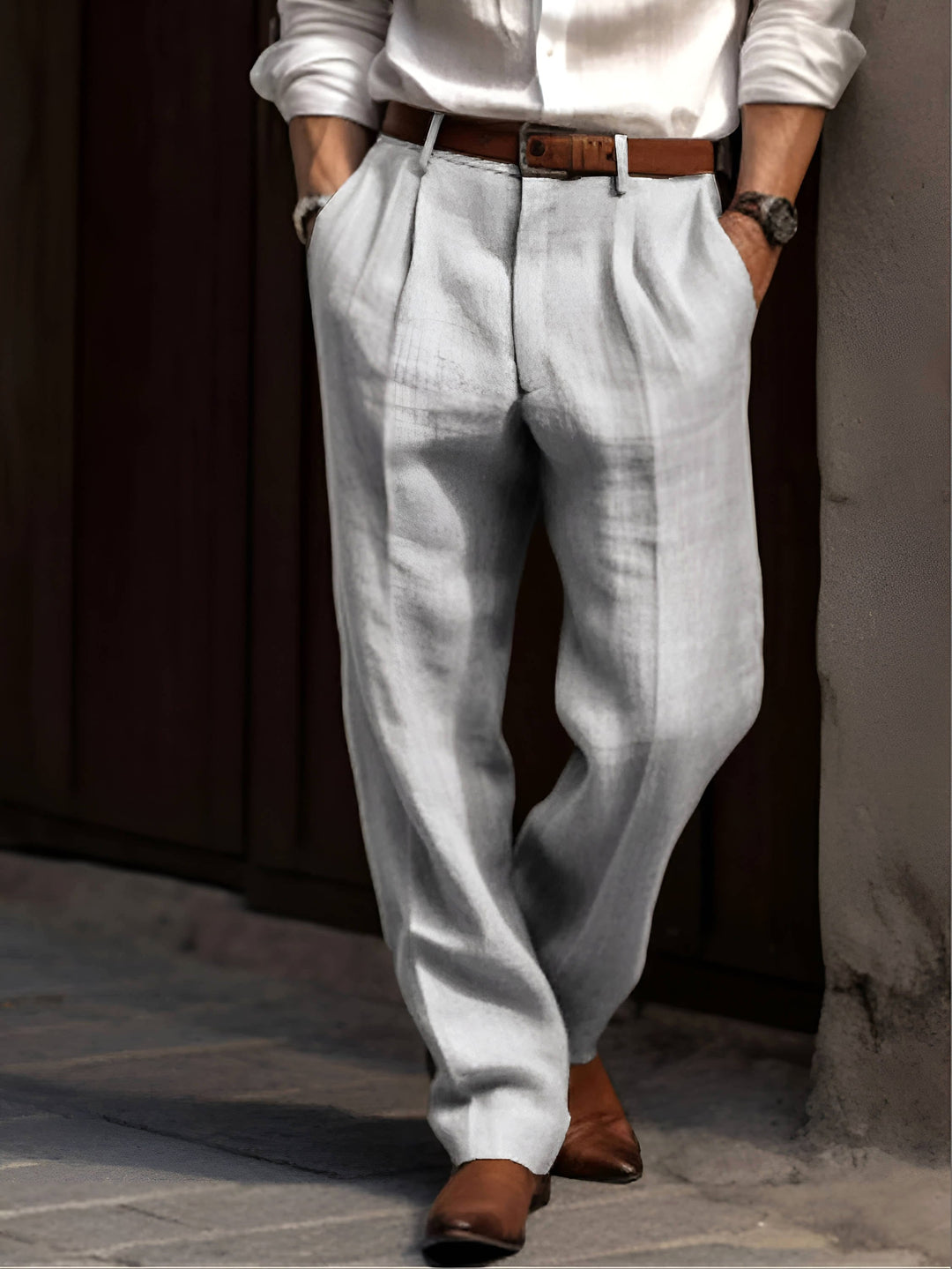 Tailored men's dress pants with a comfortable pleated design, ideal for formal wear & business fashion.