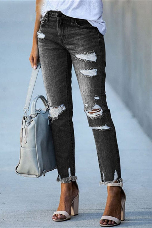 Light wash distressed women's straight leg jeans with trendy raw hem, comfortable for everyday casual wear.