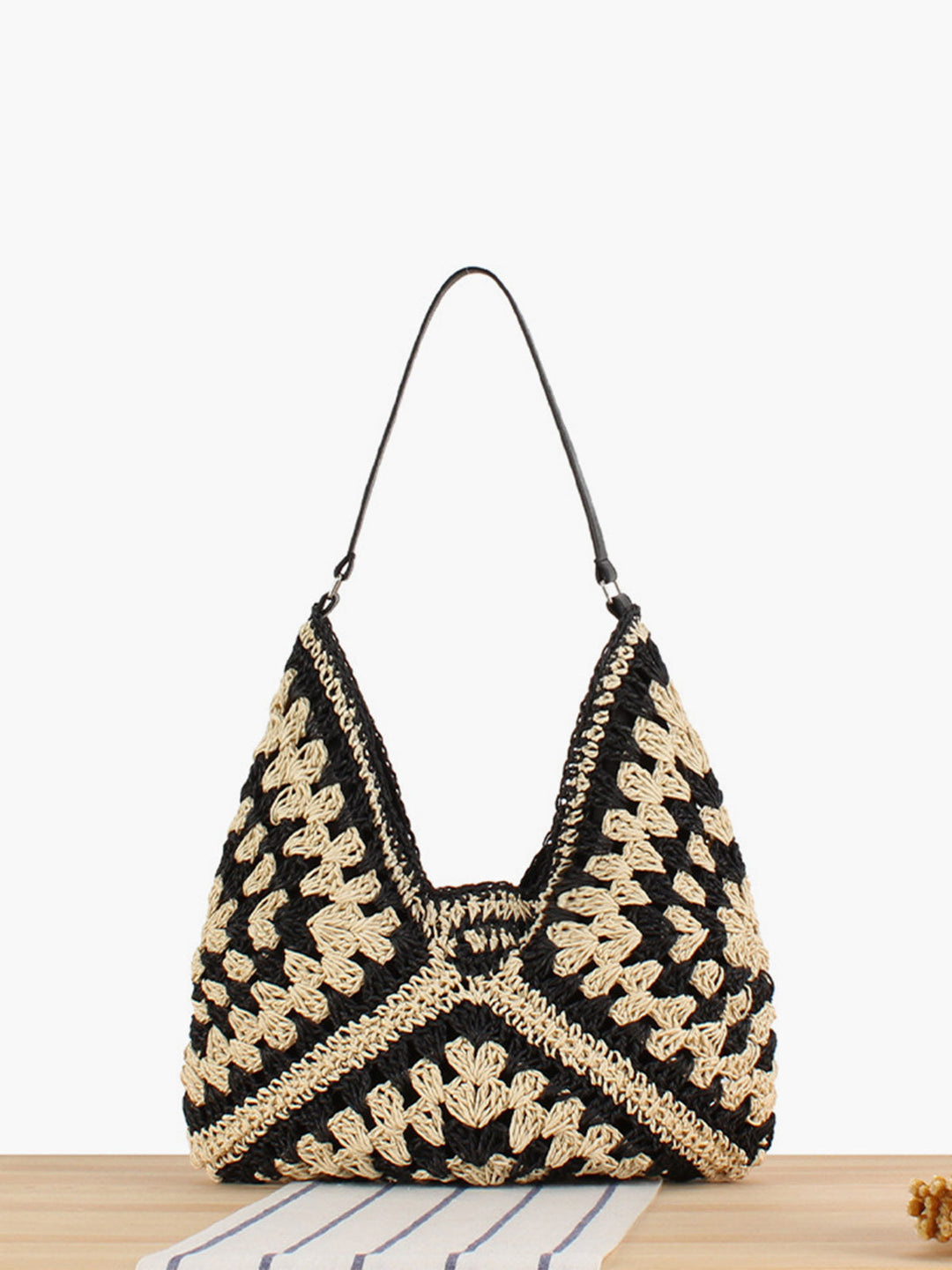 Boho crochet shoulder bag with natural geometric weave pattern, perfect for summer.