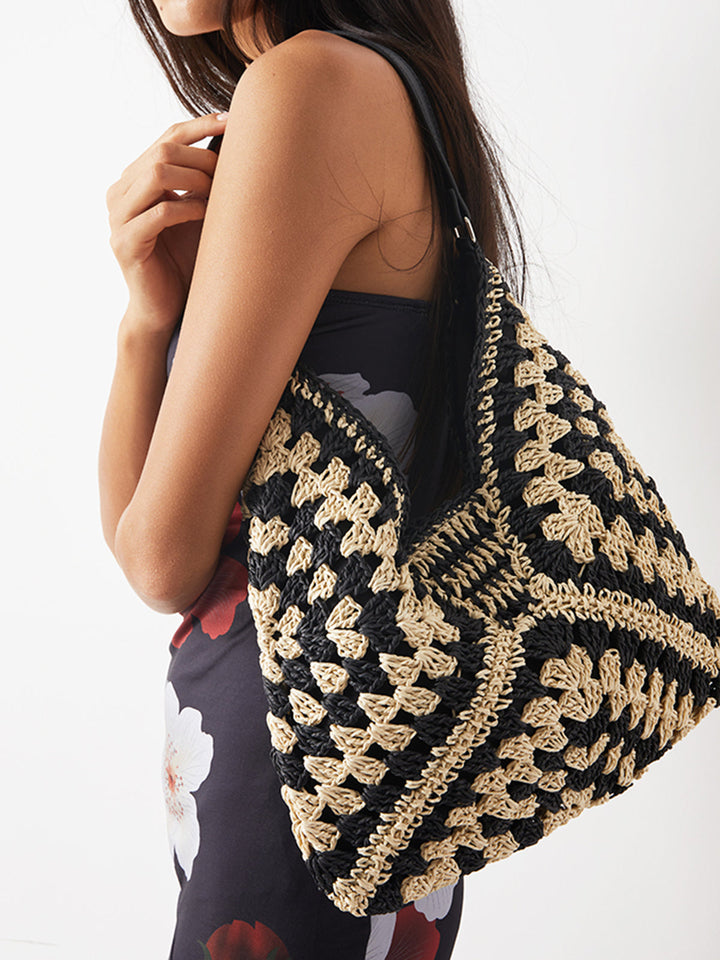 Handmade natural fiber crochet shoulder bag featuring a unique geometric design.