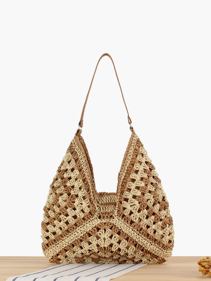 Chic straw shoulder bag with a boho crochet geometric pattern, perfect for travel.