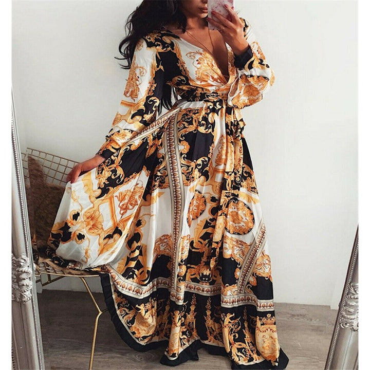 Relaxed fit women's boho summer dress, wrap style with long sleeves and an airy slit detail.
