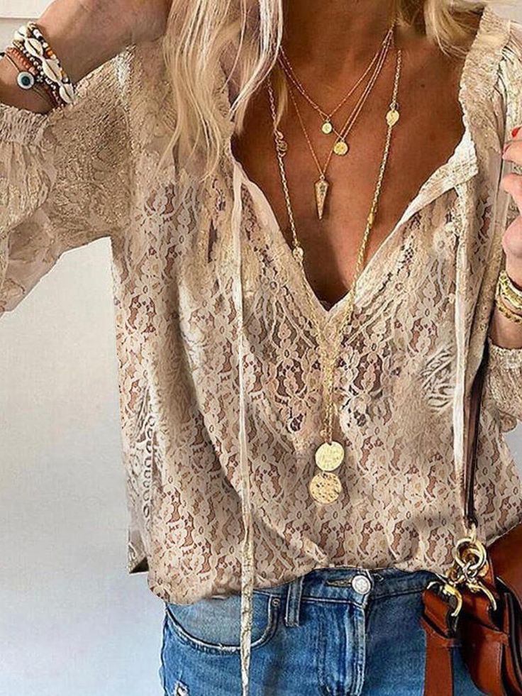 Women's effortless boho lace v-neck blouse, relaxed fit for chic summer casual wear.